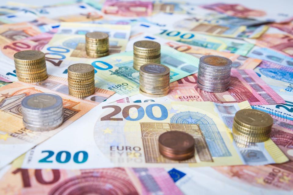 A combination of different Euro banknotes and Euro coins as a closeup