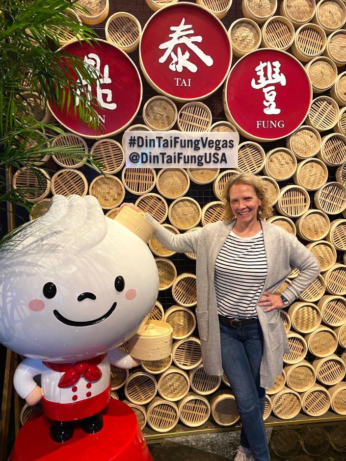 din tai fun las vegas wendy standing outside with cartoon dumpling