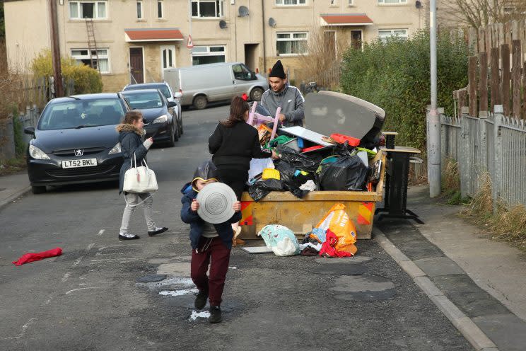 Neighbours help themselves to Mrs Doran’s dumped belongings (credit: SWNS)