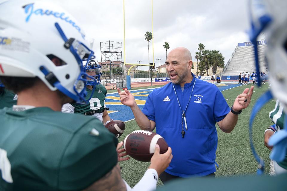 Javelina head coach Mike Salinas talks to his quarterbacks ahead of the TAMUK spring game Saturday.