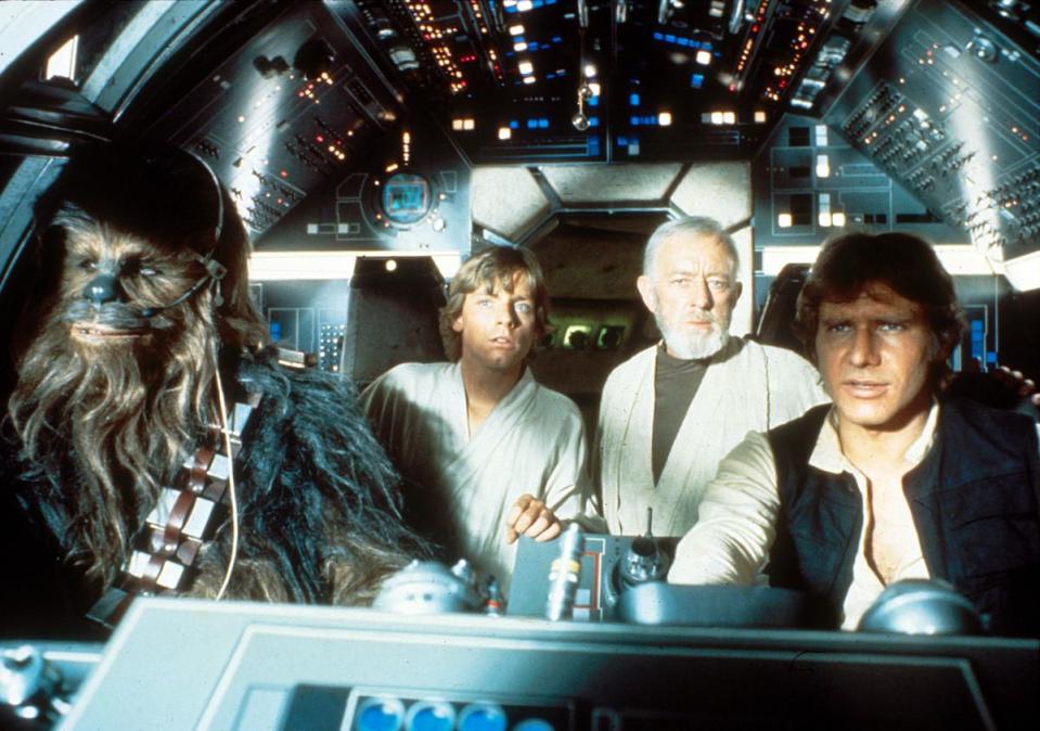 From left to right, Chewbacca (Peter Mayhew), Luke Skywalker (Mark Hamill), Obi Wan Kenobi (Alec Guinness) and Han Solo (Harrison Ford) are aboard the Millennium Falcon in the hit 1977 film “Star Wars: A New Hope.”