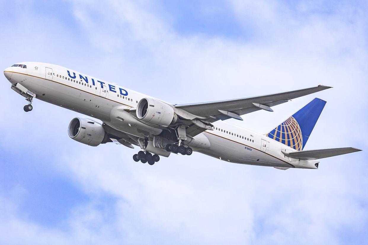 United Airlines Boeing wide body 777-200 aircraft as seen during take off and flying phase