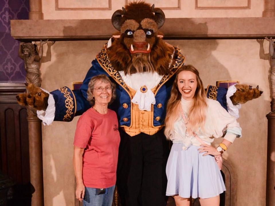 kayleigh and her mom posing with the beast at be our guest restaurant