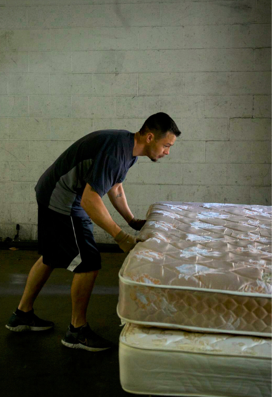 Victory Mission restoration program participant helps recycle mattresses through the new workforce development program.