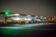 Technicians prepare Solar Impulse 2 for take off at Cairo's International Airport on July 25, 2016