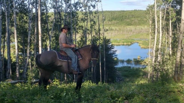 John Prosak on the trail from Sturgeon River Ranch into Prince Albert National Park.  (Sturgeon River Ranch  - image credit)