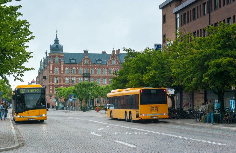 <span class="caption">Local buses in the Swedish city of Lund, home of the Centre for Sustainability Studies.</span> <span class="attribution"><a class="link " href="https://www.shutterstock.com/image-photo/july-10-2021-lund-sweden-local-2026029437" rel="nofollow noopener" target="_blank" data-ylk="slk:Shutterstock;elm:context_link;itc:0;sec:content-canvas">Shutterstock</a></span>