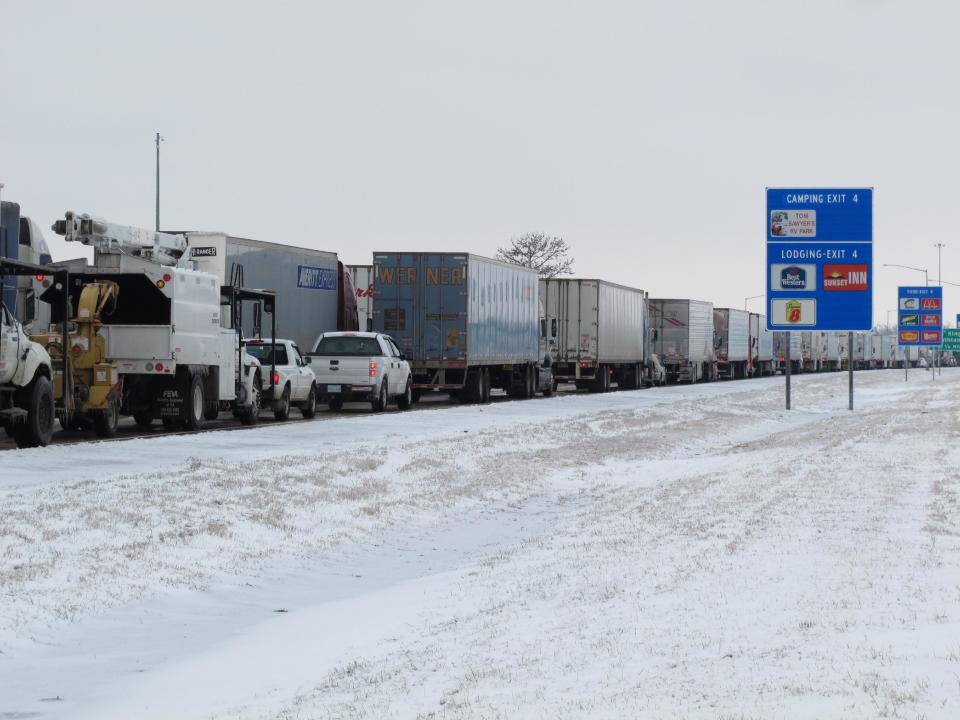 Trucks sit in a massive traffic backup on Interstate 55, Tuesday, March 4, 2014 in West Memphis, Ark. (AP Photo/Adrian Sainz)