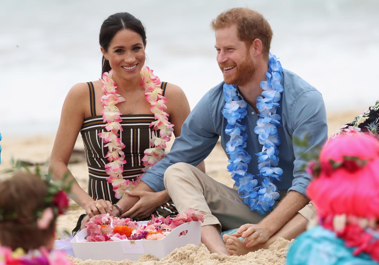 <p>Prince Harry, Duke of Sussex and Meghan, Duchess of Sussex talk to members of OneWave, an awareness group for mental health and wellbeing at South Bondi Beach on October 19, 2018 in Sydney, Australia.</p> (Photo by Chris Jackson-Pool/Getty Images)