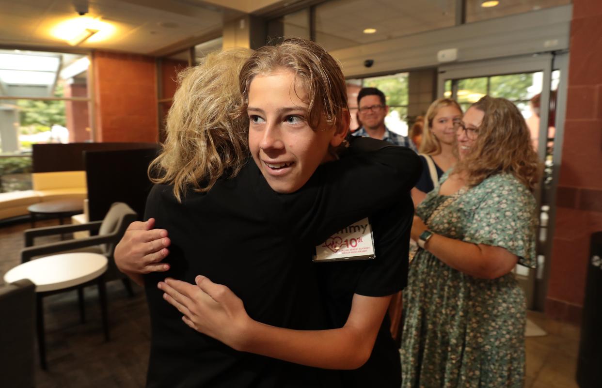 Tommy Anthony, 15, hugs registered nurse Debbie Licht-Mayer at the 10th anniversary of the Cardiac Arrest Survivor Support Group at Los Robles Regional Medical Center in Thousand Oaks on Wednesday. Tommy was an infant when he suffered a full arrest and was brought to Los Robles Hospital where nurses Licht-Mayer and Mike Kerner worked to save his life.