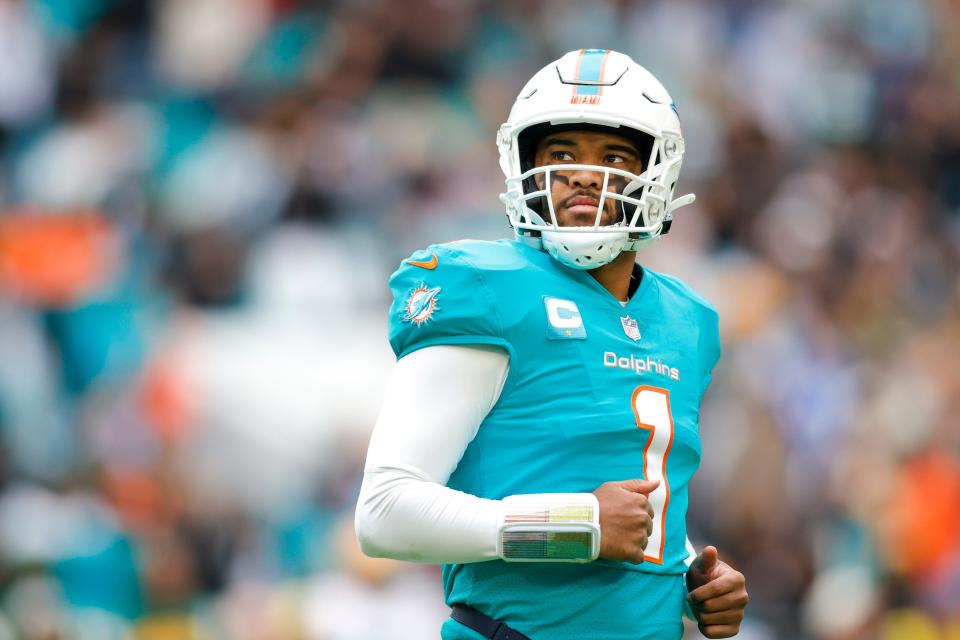 Miami Dolphins quarterback Tua Tagovailoa looks on from the field during the second quarter against the Green Bay Packers at Hard Rock Stadium.