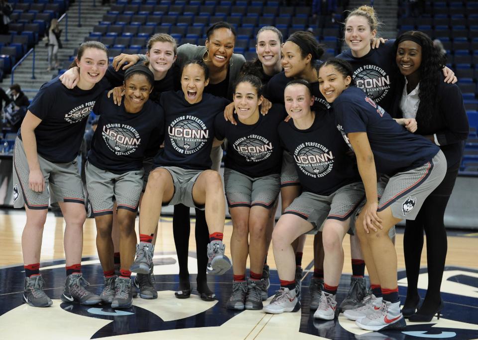 The Connecticut women's basketball team pose for a photograph at the end an NCAA college basketball game against South Florida, Tuesday, Jan. 10, 2017, in Hartford, Conn. (AP Photo/Jessica Hill)