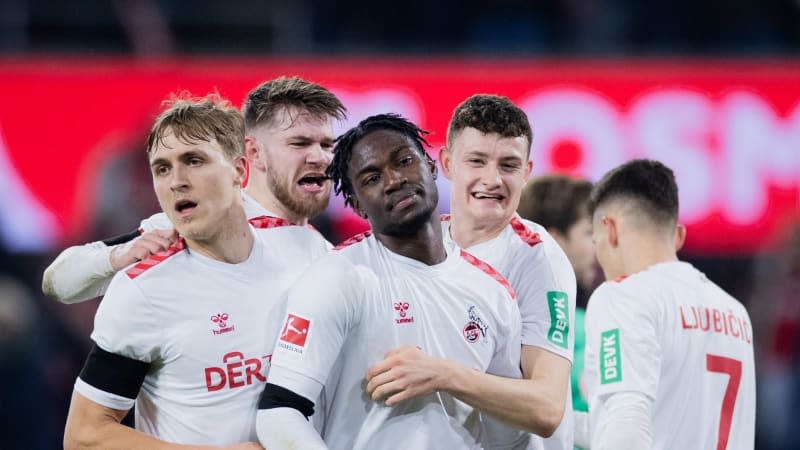 Cologne's Faride Alidou (C) celebrates scoring his side's first goal with teammates during the German Bundesliga soccer match between 1. FC Cologne and Eintracht Frankfurt at RheinEnergieStadion. Rolf Vennenbernd/dpa