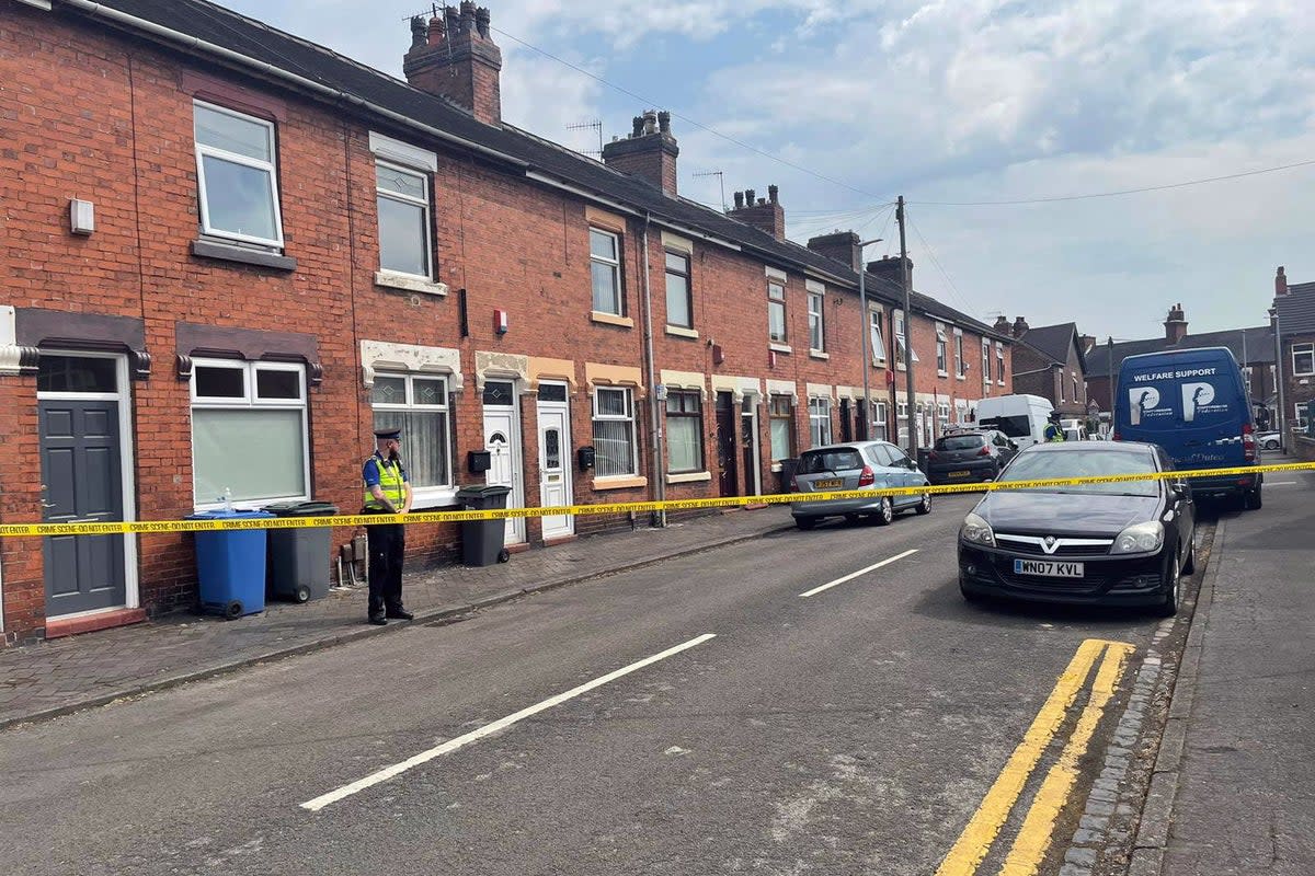A police community support officer at the scene on Flax Street, Stoke-on-Trent, Staffordshire (PA Wire)