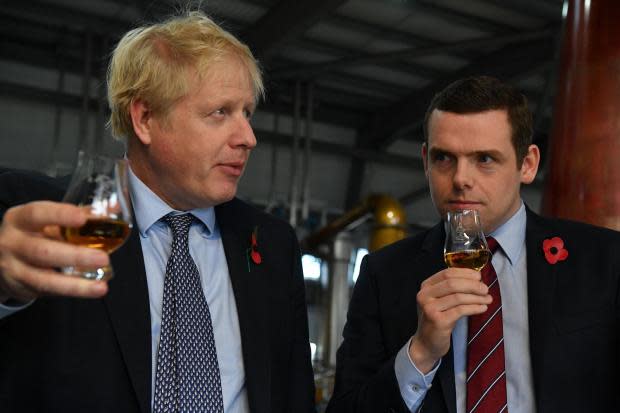 Douglas Ross pictured with Prime Minister Boris Johnson during a visit to a distillery.