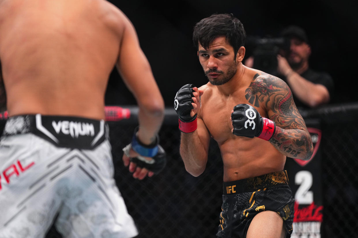 LAS VEGAS, NEVADA - DECEMBER 16: (R-L) Alexandre Pantoja of Brazil faces Brandon Royval in the UFC flyweight championship fight during the UFC 296 event at T-Mobile Arena on December 16, 2023 in Las Vegas, Nevada. (Photo by Cooper Neill/Zuffa LLC via Getty Images)