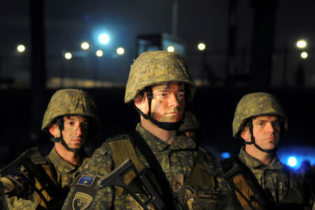 FILE PHOTO: Soldiers of Kosovo Security Force stand guard during the army formation ceremony in Pristina, Kosovo, December 14, 2018. REUTERS/Laura Hasani/File Photo