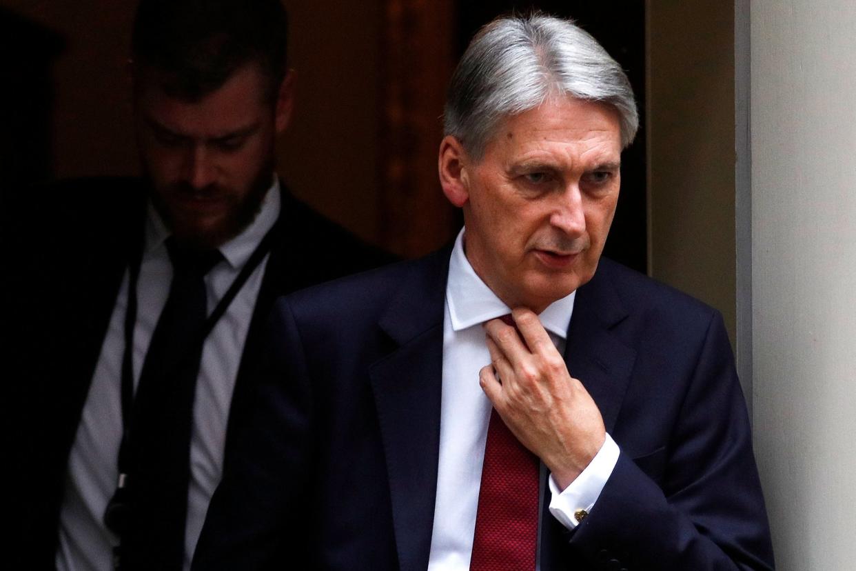 Chancellor Philip Hammond leaves 11 Downing Street earlier this week: REUTERS