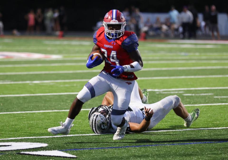 Immanuel Johnson (24) of Hammond carries the ball during Hammond’s game against visiting Grey Collegiate on Friday, September 1, 2023.