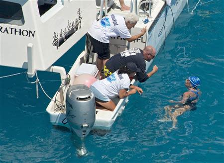 Swimmer Diana Nyad converses with her crew less than two miles off Key West