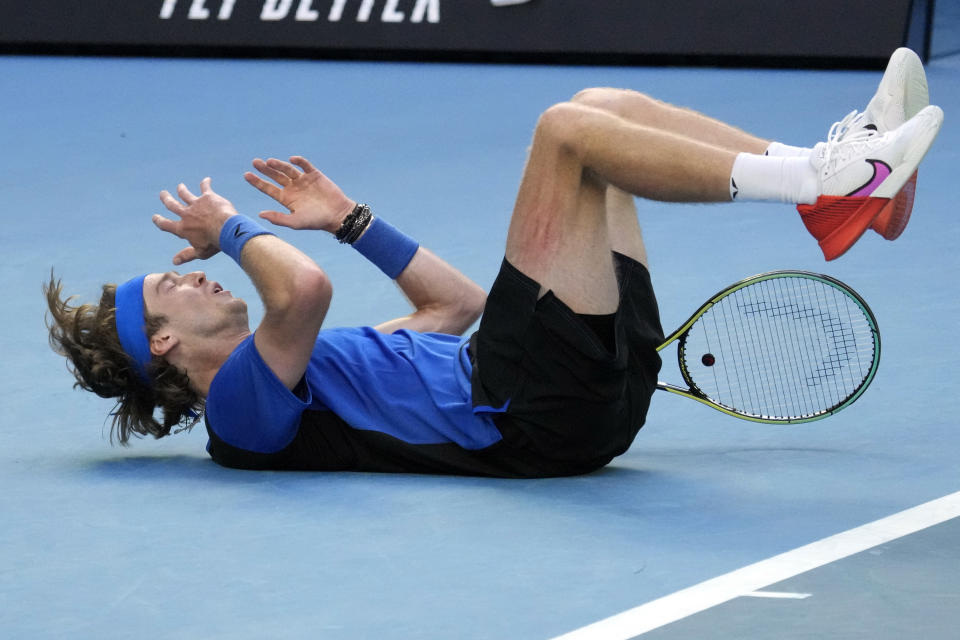 Andrey Rublev of Russia celebrates after defeating Holger Rune of Denmark in their fourth round match at the Australian Open tennis championship in Melbourne, Australia, Monday, Jan. 23, 2023. (AP Photo/Aaron Favila)