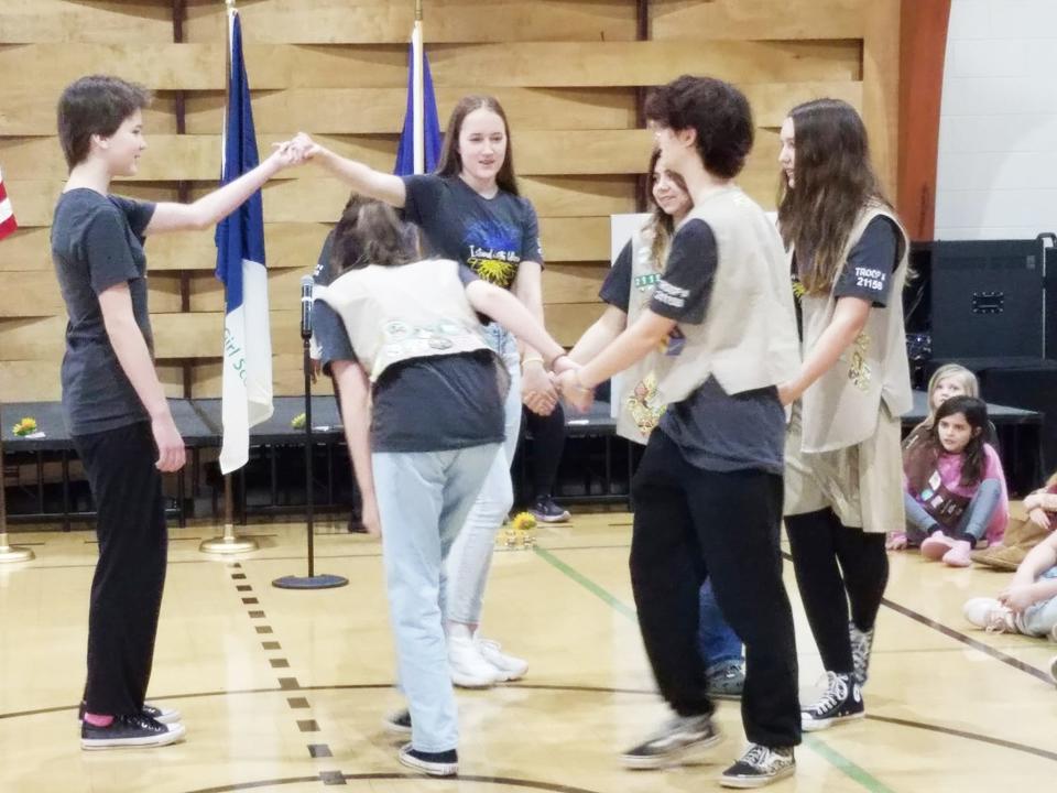 Ukrainian members of Oak Ridge Cadette Troop 21158 taught a traditional dance from their country at the recent Girl Scout International Fest.