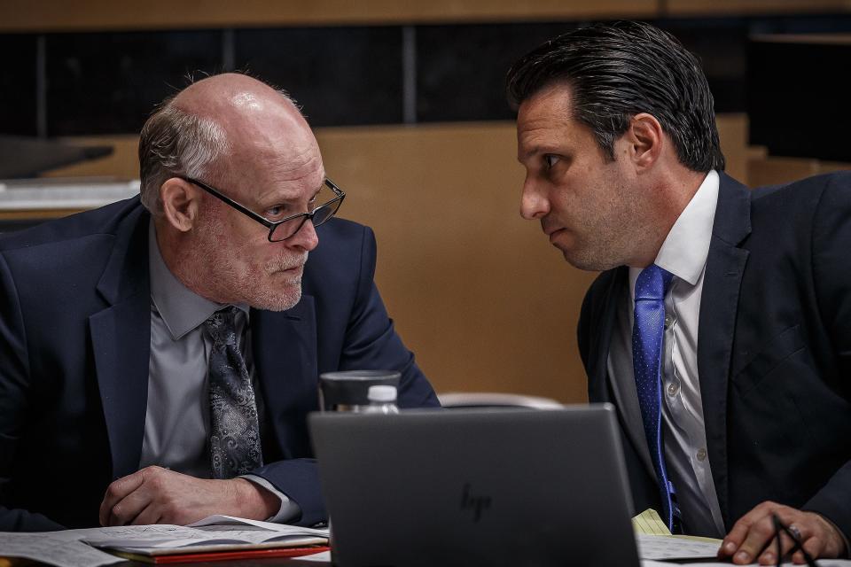 Joseph Hamilton, center, talks with his public defender Stephen Arbuzow at the Palm Beach County Courthouse in downtown West Palm Beach, Fla., on March 28, 2023.