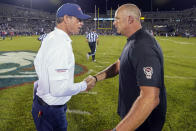 UConn head coach Jim Mora, left, shakes the hand of North Carolina State head coach Dave Doeren, right, after an NCAA college football game in East Hartford, Conn., Thursday, Aug. 31, 2023. (AP Photo/Bryan Woolston)