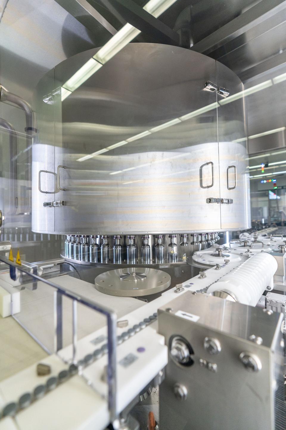 The new Pfizer-BioNTech COVID-19 booster is seen being produced. The booster is meant to target both the original strain of the virus as well as the BA.4 and BA.5 omicron subvariants.