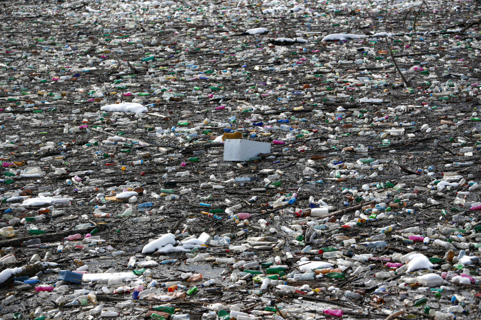 Plastic bottles and waste float at the Potpecko accumulation lake near Priboj, in southwest Serbia, Friday, Jan. 22, 2021. Serbia and other Balkan nations are virtually drowning in communal waste after decades of neglect and lack of efficient waste-management policies in the countries aspiring to join the European Union. (AP Photo/Darko Vojinovic)