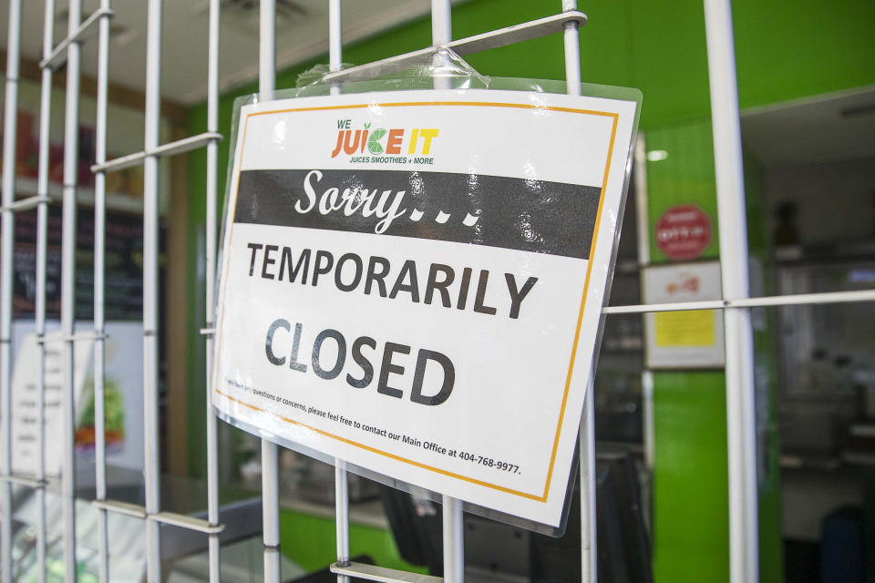 We Juice It is closed in the domestic terminal food court at Hartsfield-Jackson International Airport in Atlanta, Tuesday, April 14, 2020. (Alyssa Pointer/Atlanta Journal-Constitution via AP)