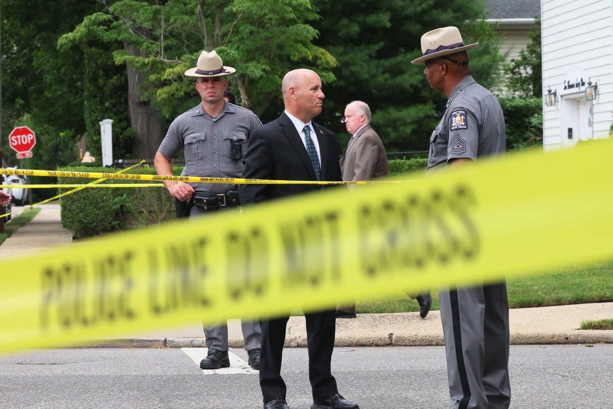  Law enforcement officials are seen at home of a suspect (Getty Images)