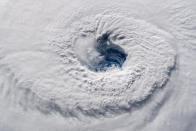 In this Sept. 12, 2018 photo provided by NASA, Hurricane Florence churns over the Atlantic Ocean heading for the U.S. east coast as seen from the International Space Station. Astronaut Alexander Gerst, who shot the photo, tweeted: "Ever stared down the gaping eye of a category 4 hurricane? It's chilling, even from space." (Alexander Gerst/ESA/NASA via AP)