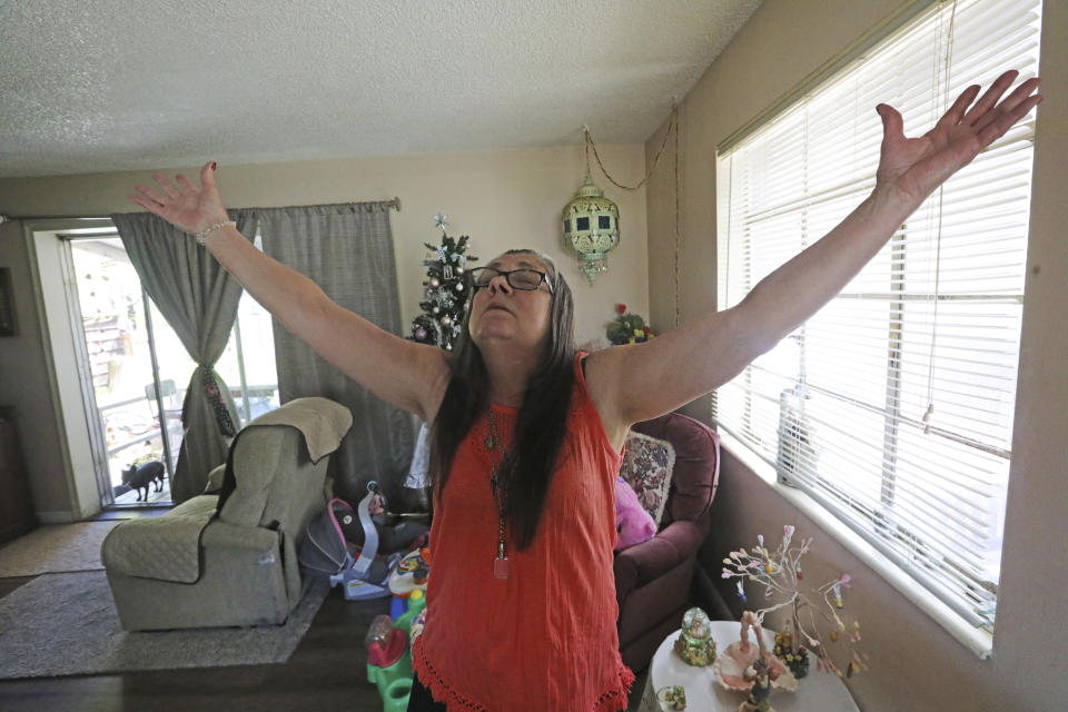 Melany Zoumadakis stands in her home Wednesday, April 24, 2019, in Salt Lake City, talking about the grief she has endured since the 2016 death of her daughter, Tanna Jo Fillmore. Fillmore, who had a history of mental problems, killed herself in 2016 at the Duchesne County Jail in Utah. Her mother, who has filed a lawsuit, says her daughter was denied her prescription medications and had threatened to harm herself. (AP Photo/Rick Bowmer)