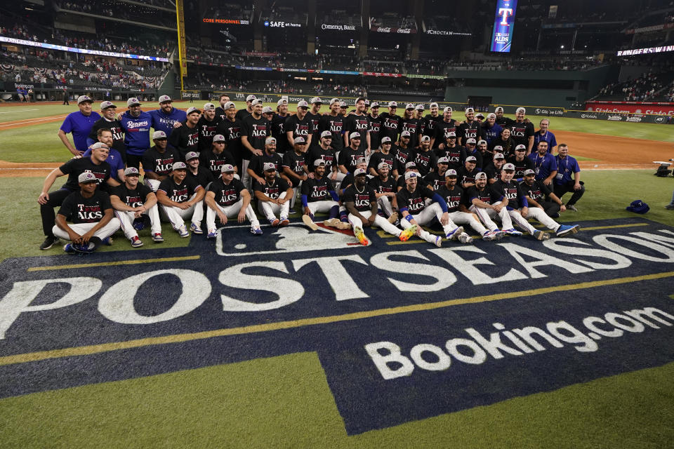 The Texas Rangers celebrate after defeating the Baltimore Orioles in Game 3 of a baseball AL Division Series on Tuesday, Oct. 10, 2023, in Arlington, Texas. (AP Photo/Tony Gutierrez )