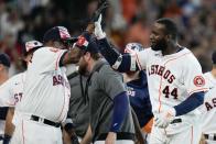 Houston Astros designated hitter Yordan Alvarez (44) celebrates his walkoff home run with manager Dusty Baker during the ninth inning of a baseball game against the Kansas City Royals, Monday, July 4, 2022, in Houston. (AP Photo/Eric Christian Smith)