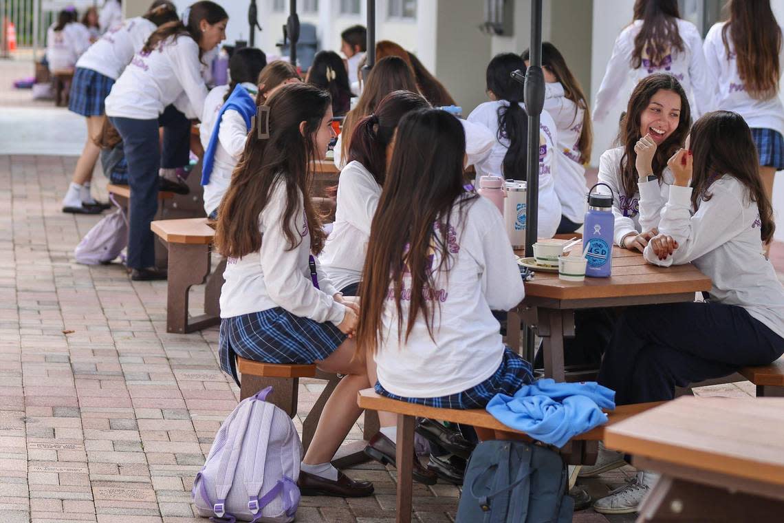 Students at Our Lady of Lourdes Catholic Academy take a lunch break at the prestigious all-girls school in South Miami. Demand is up for seats while some public schools are seeing declining attendance. Carl Juste/cjuste@miamiherald.com