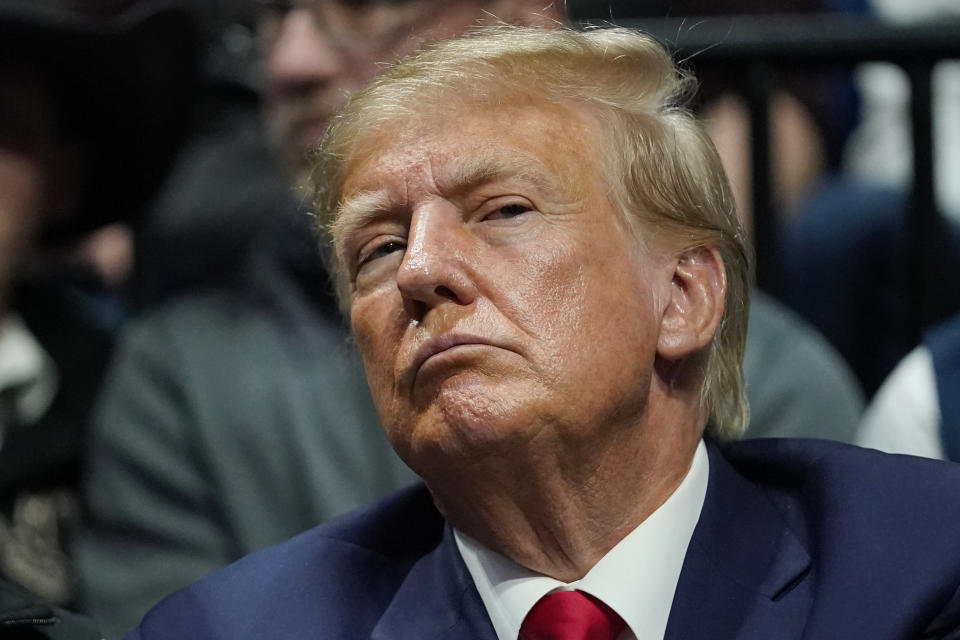 Former President Donald J. Trump watches the NCAA Wrestling Championships, Saturday, March 18, 2023, in Tulsa, Okla. (AP Photo/Sue Ogrocki)