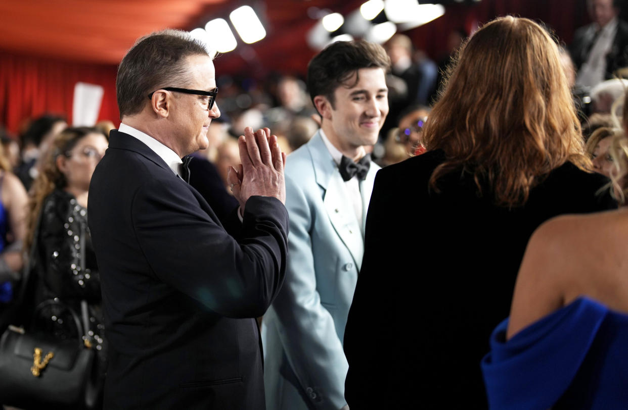 Brendan Fraser arrives with his sons at the Oscars on Sunday, March 12, 2023 in Los Angeles. (John Locher / AP)