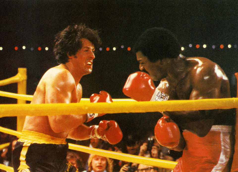 Sylvester Stallone as Rocky Balboa and Carl Weather as Apollo Creed in Rocky