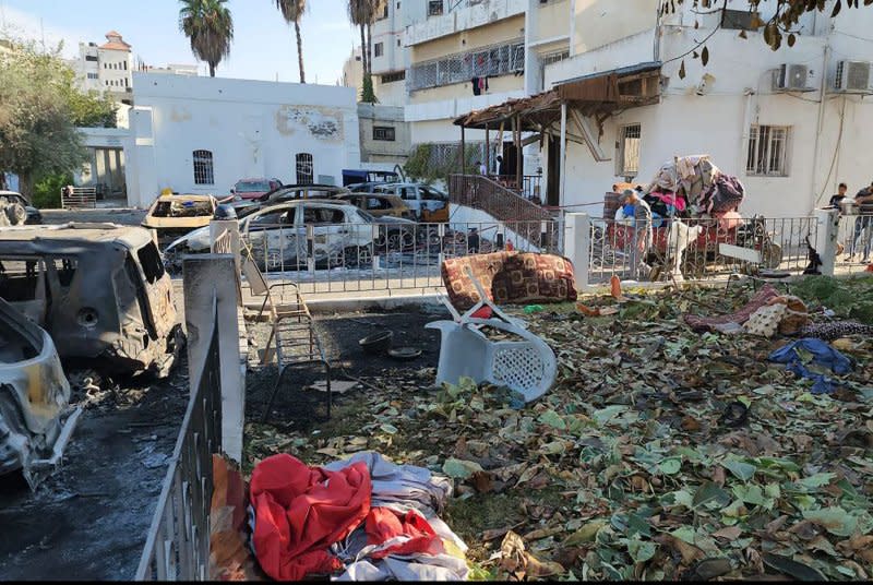 Debris litters the site of the Al-Ahli Arab Hospital in central Gaza City on Wednesday, a day after it was hit with an airstrike, killing hundreds. Photo by Muthana Alnajjar/UPI