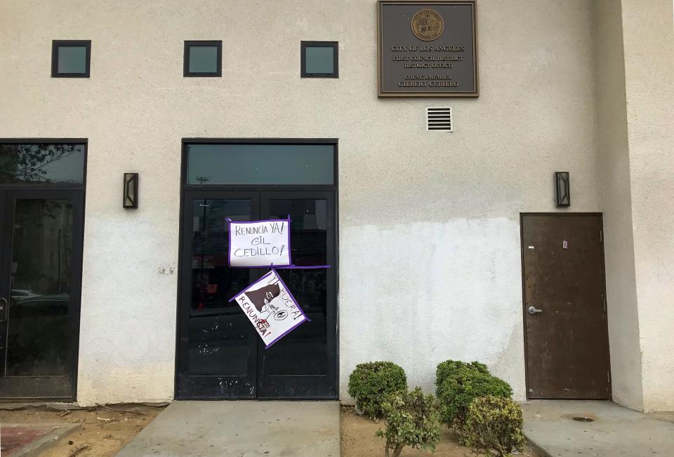 Signs calling for Los Angeles City Councilor Gil Cedillo's resignation on his Westlake district office's door. Cedillo was one of three city councilors and a labor leader caught on a leaked tape that contained derogatory and racist comments about fellow city councilors and Angelenos.