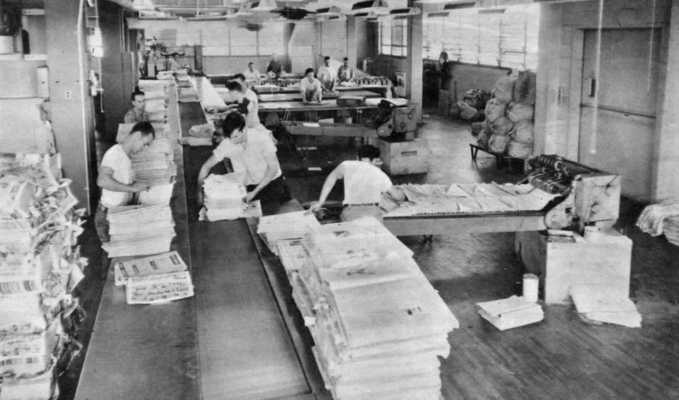 Mailroom workers sort newspapers before delivery at The Sacramento Bee’s new building at 21st and Q streets in 1952. They came to the mailroom in lots of 25 or 50 “counted magically by the press.”