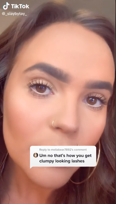 Woman showing off long lashes on TikTok