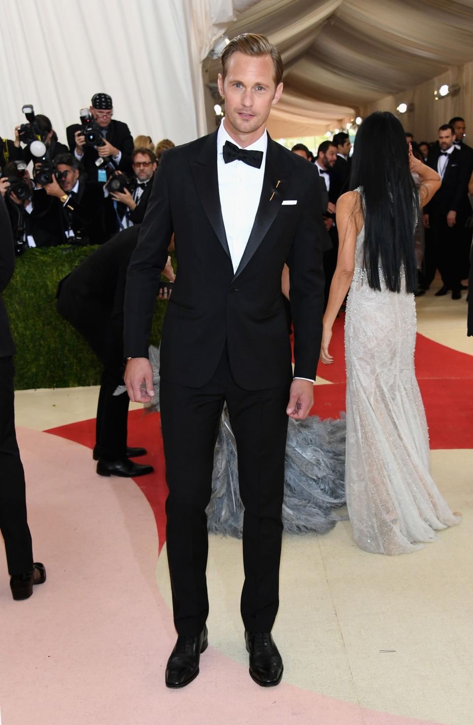 <h1 class="title">Alexander Skarsgard in a Cartier pin and Louis Leeman shoes</h1><cite class="credit">Photo: Getty Images</cite>