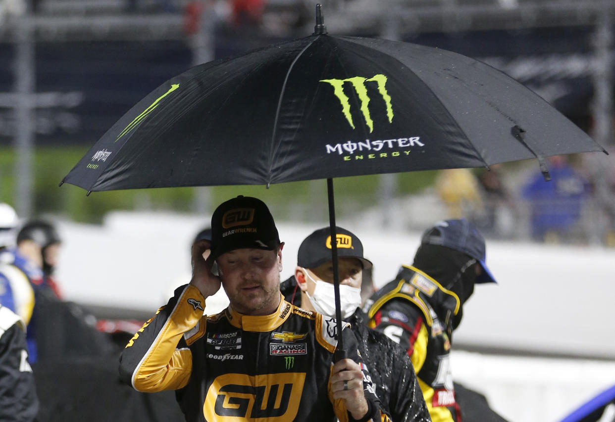 MARTINSVILLE, VIRGINIA - APRIL 10: Kurt Busch, driver of the #1 GEARWRENCH Chevrolet, walks the grid during a rain delay during a rain delay prior to the NASCAR Cup Series Blue-Emu Maximum Pain Relief 500 at Martinsville Speedway on April 10, 2021 in Martinsville, Virginia. (Photo by Brian Lawdermilk/Getty Images)