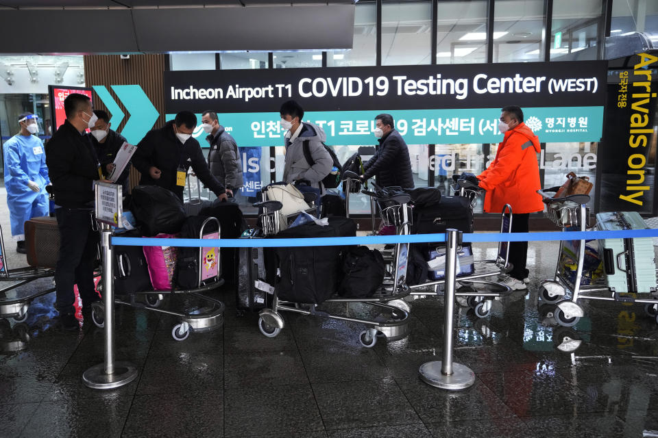 Passengers arriving from China arrive at a COVID-19 testing center at the Incheon International Airport in Incheon, South Korea on Jan. 14, 2023. A hoped-for boom in Chinese tourism in Asia over next week’s Lunar New Year holidays looks set to be more of a blip as most travelers opt to stay inside China if they go anywhere. (AP Photo/Ahn Young-joon)