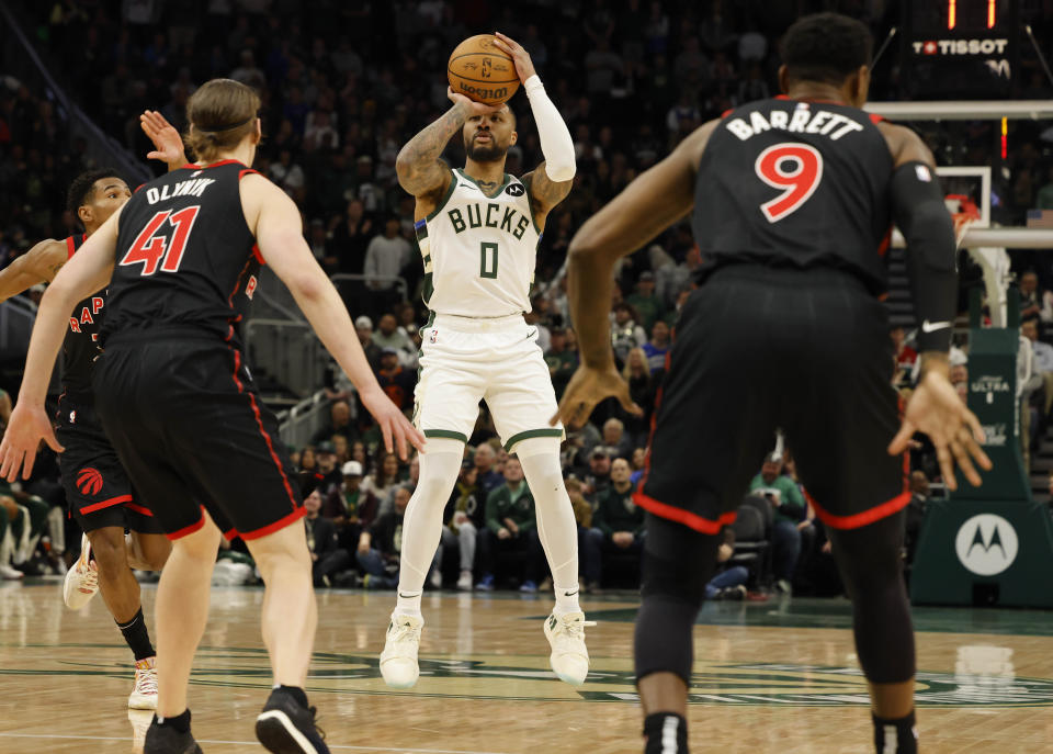 Milwaukee Bucks' Damian Lillard looks to shoot against the Toronto Raptors during an NBA basketball game Friday, April 5, 2024, in Milwaukee. (AP Photo/Jeffrey Phelps)