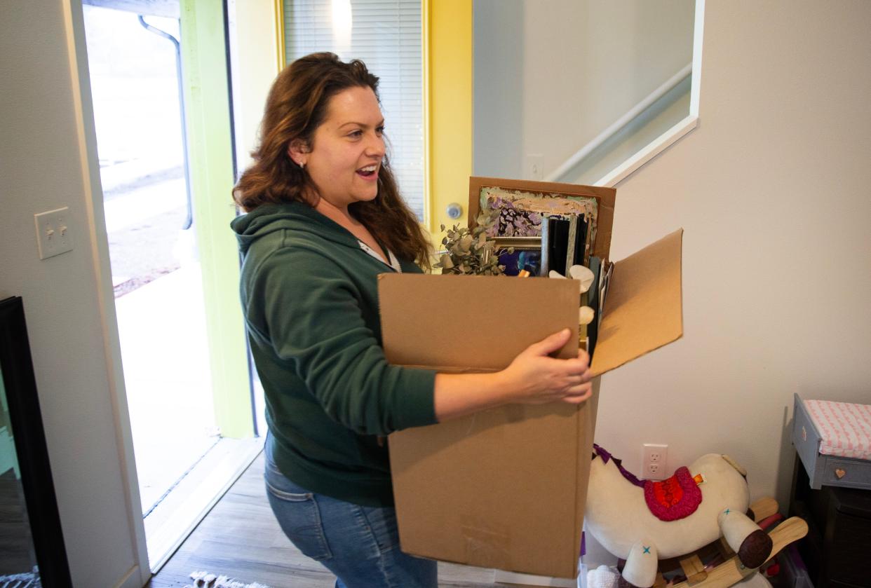 Emily Sikora moves her belongings into her new home at Peace Village just in time for the holidays.