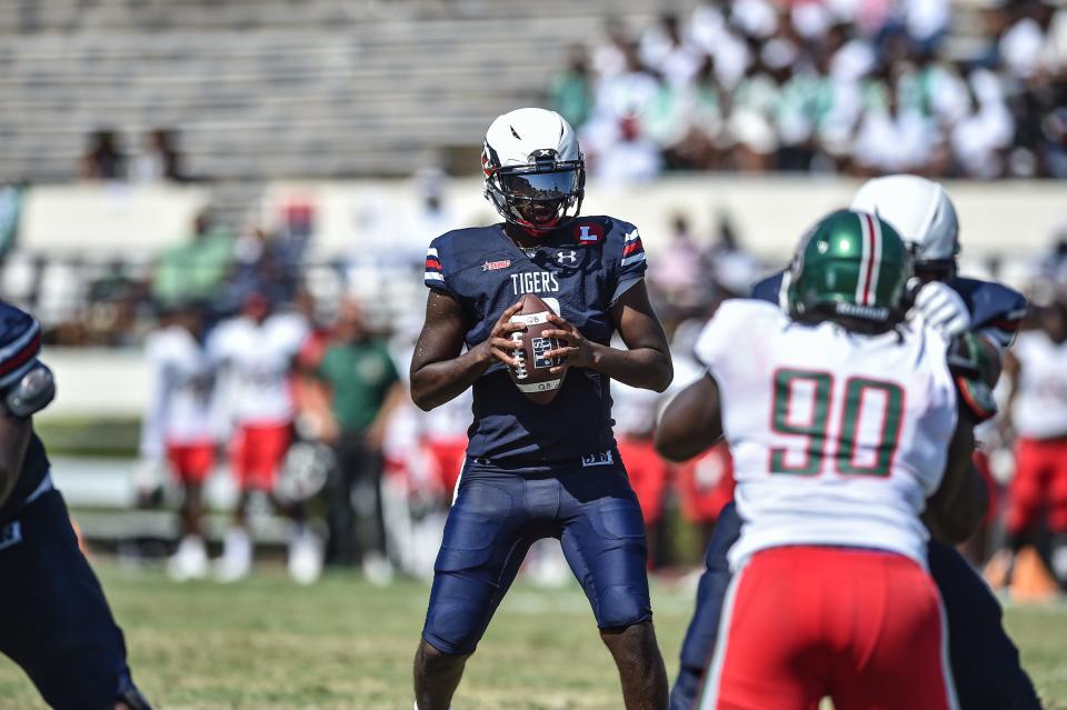 Jackson State QB Shedeur Sanders (2) looks for an opening during an NCAA college football game against Mississippi Valley State in Jackson, Miss., Saturday, Sept. 24, 2022. 